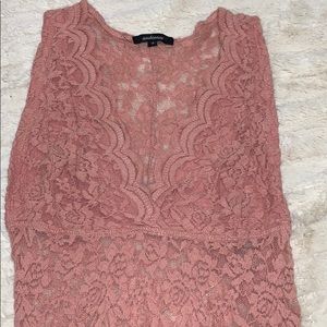 Lace body suit with razor back.